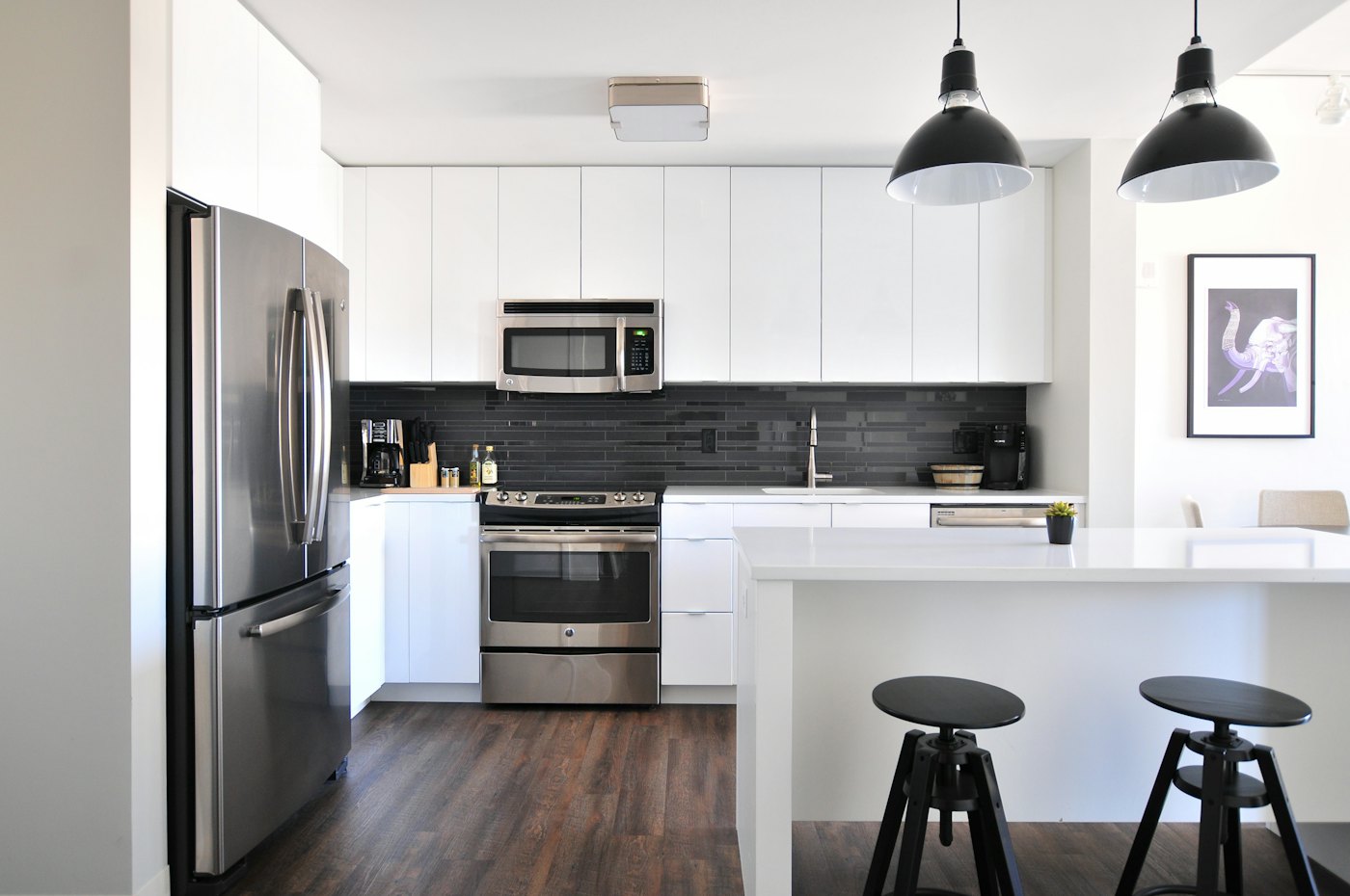 White kitchen with black pendant lights