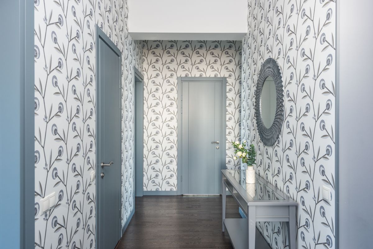 Hallway finished with patterned floral wallpaper